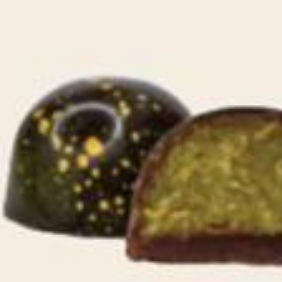 Pistachio kunafa bonbon, cut to show the filling